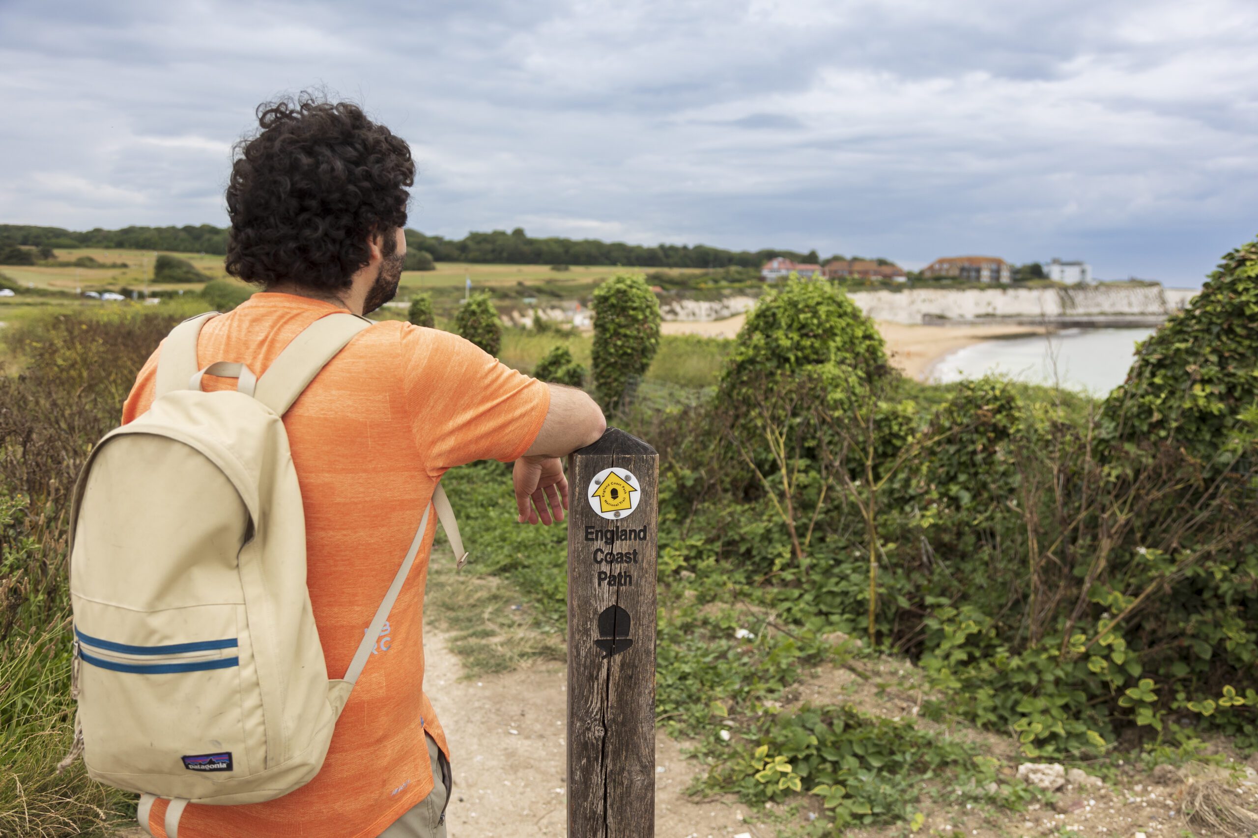 A walker looks at the view across Kings Bay