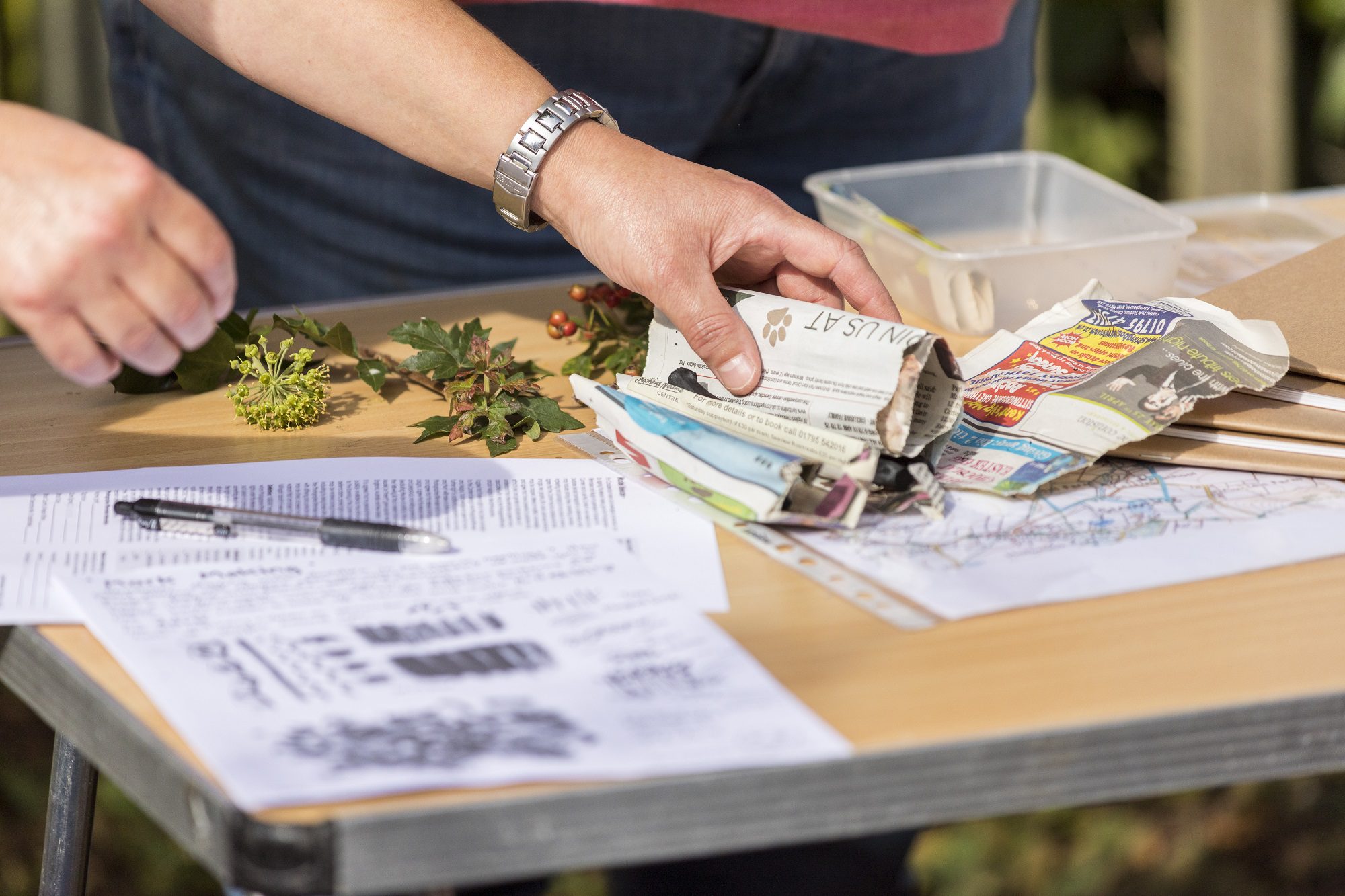 Close up of hand picking up a map