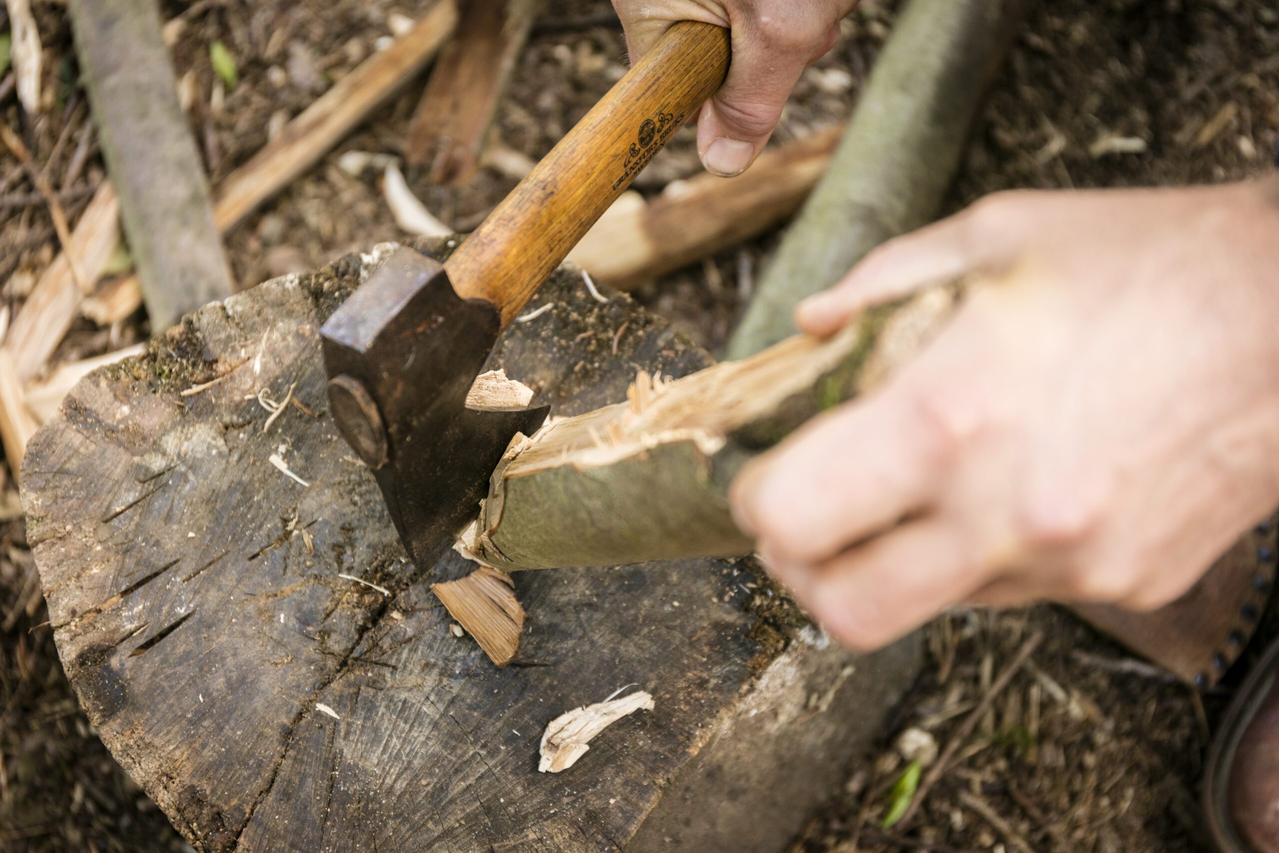 Close-up of axe chopping wood