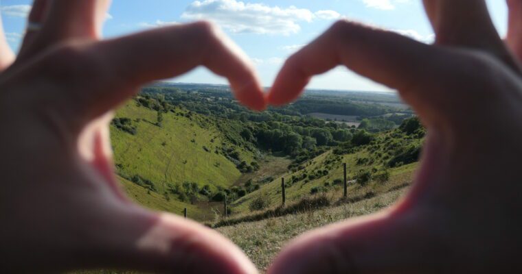 Devils Kneading Trough through fingers forming a heartshape.