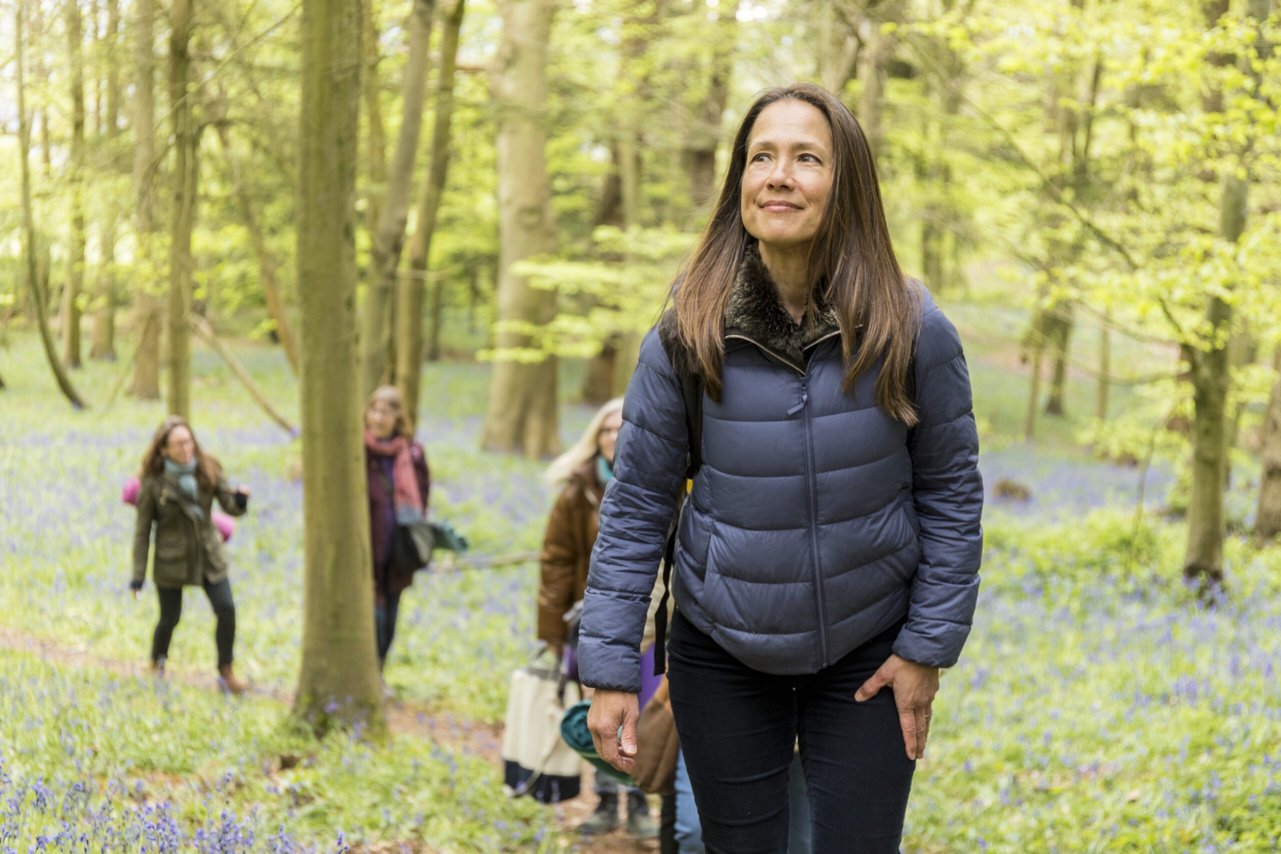 Lisa leading the group through the forest