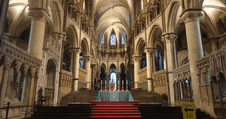 Inside Canterbury Cathedral. Steps up to alter, and arches both sides.