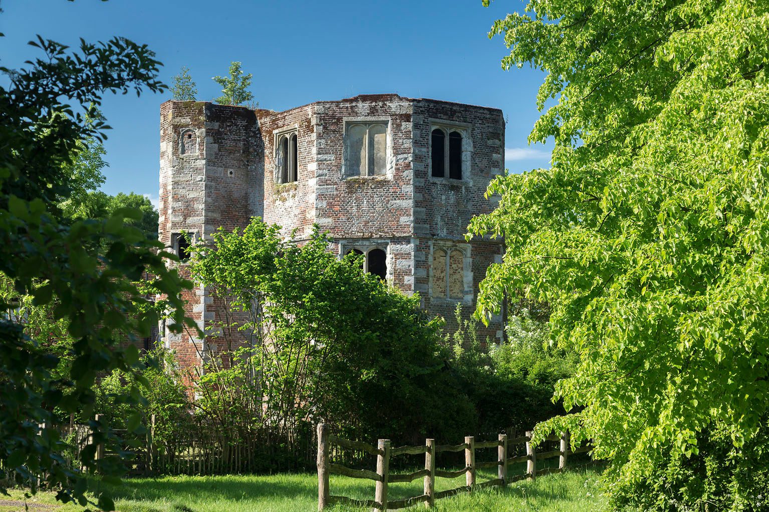 Archbishops Palace at Otford, on a sunny day with trees and bushes surrounding.