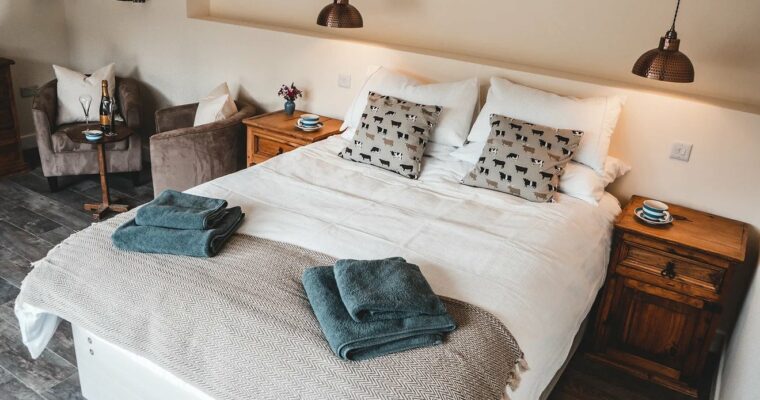 Double room at Chilton Farm, with small table and chairs with champagne on.