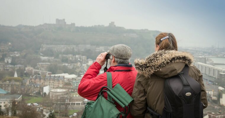 Two people looking over view across Dover.