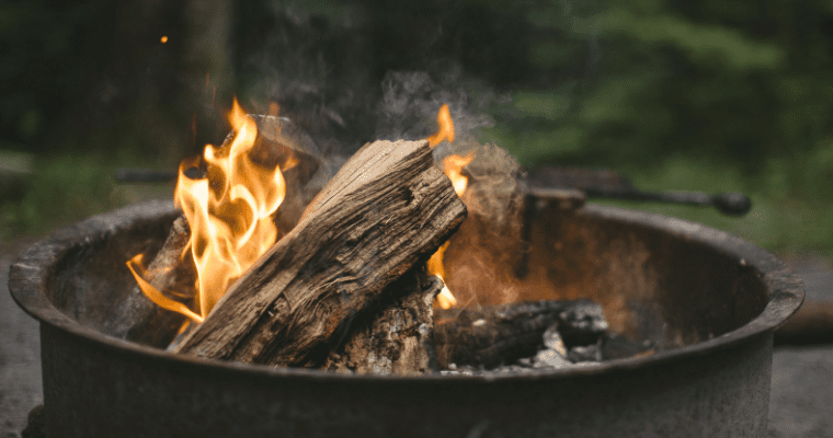 Close-up of campfire logs burning.