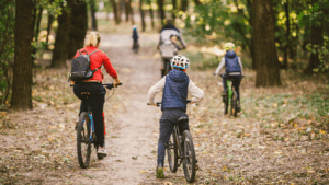 Family cycling in the woods