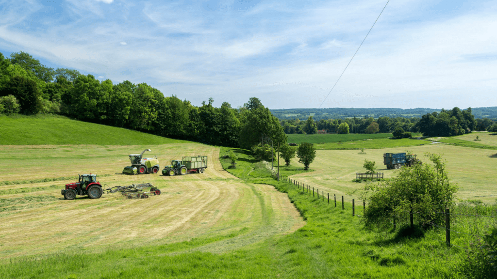 Farm vehicles in green fields in Chevening Estate