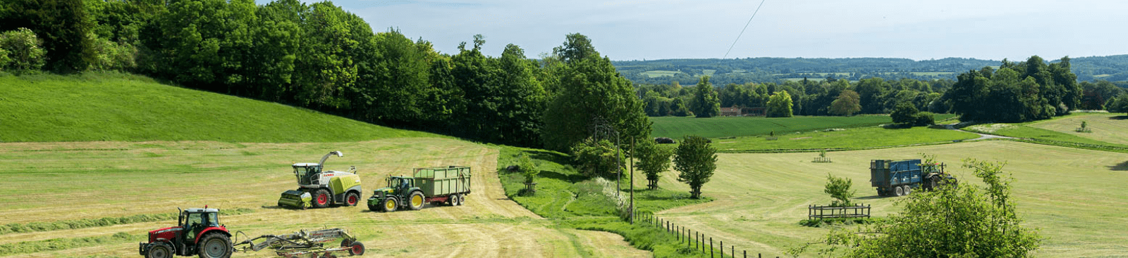 Farm vehicles in green fields in Chevening Estate