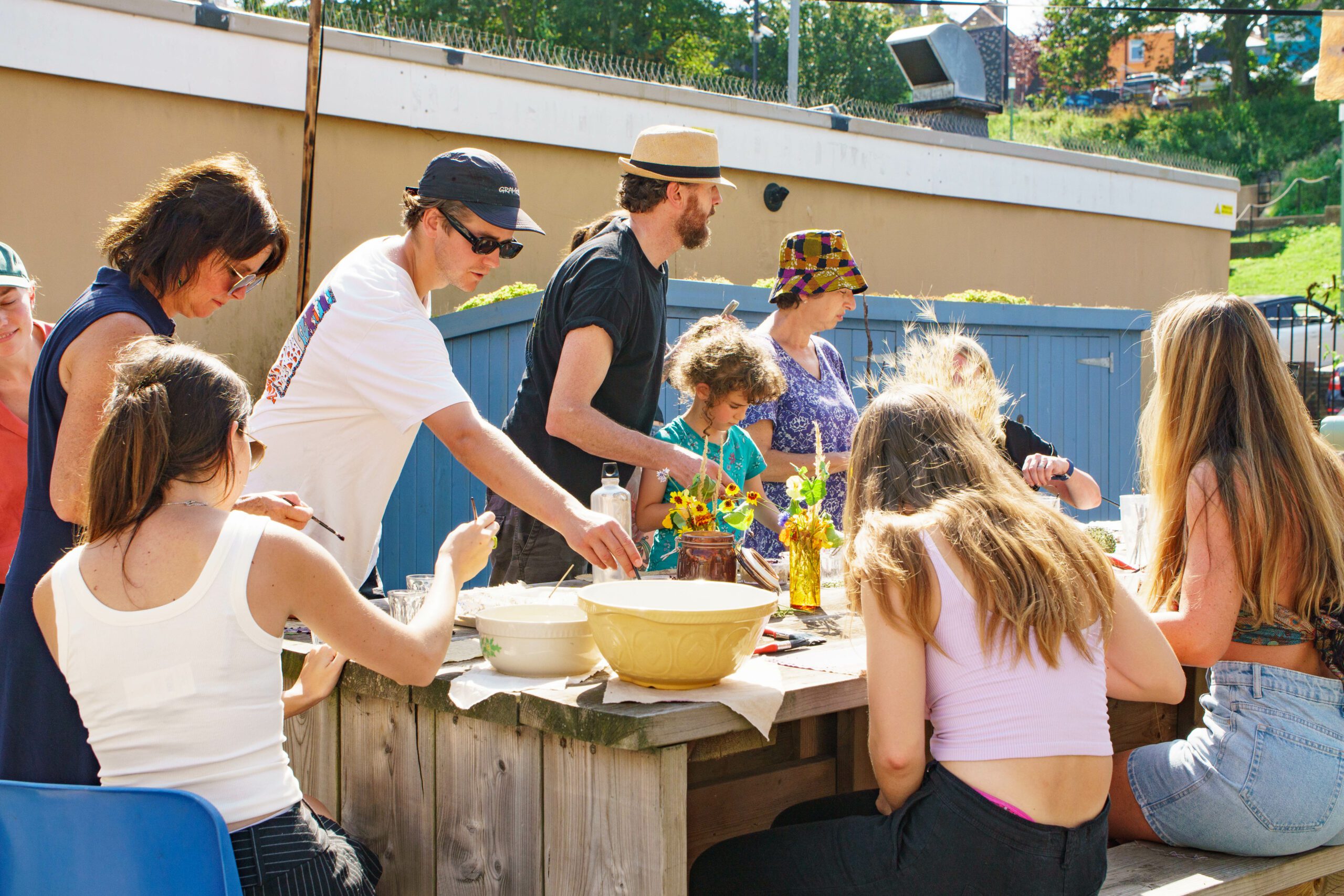 Adults and children talking park in art class