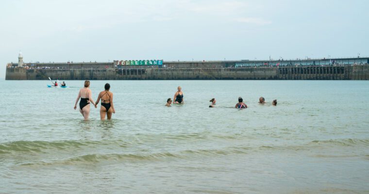 Group of people swimming in the sea