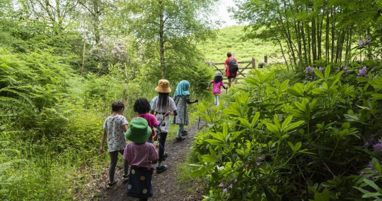 A group od children walking in the countryside.