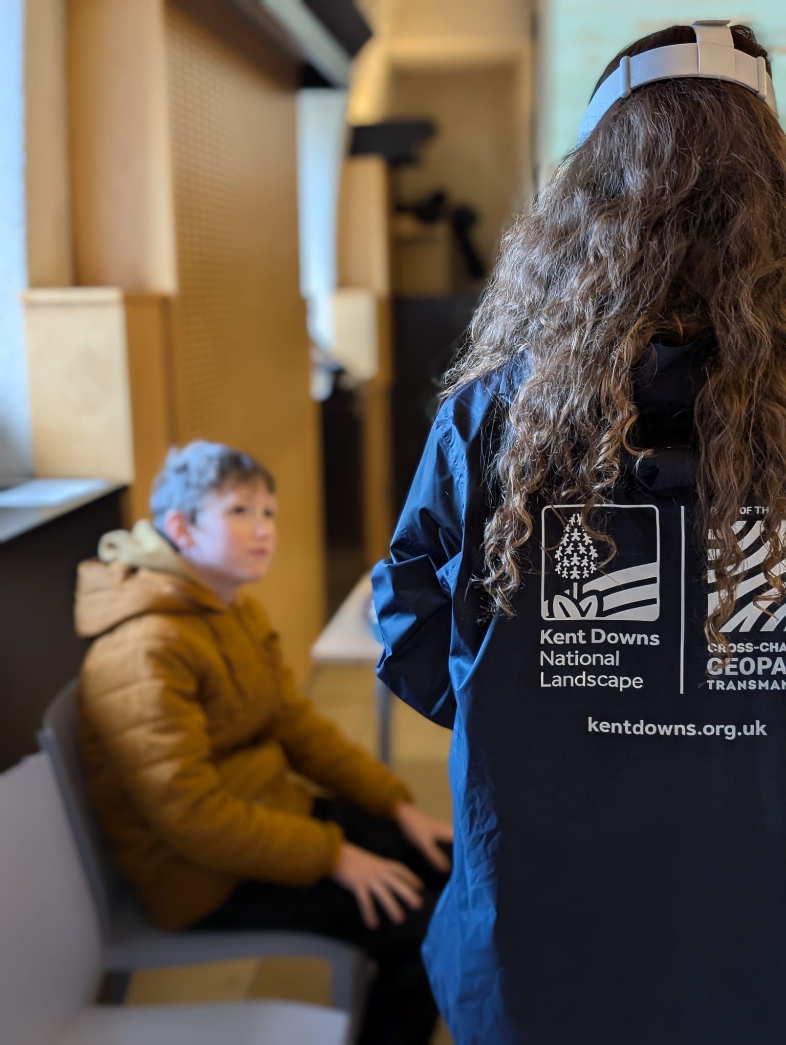 People wearing VR headsets immerse themselves in a virtual experience of a rare chalk stream.