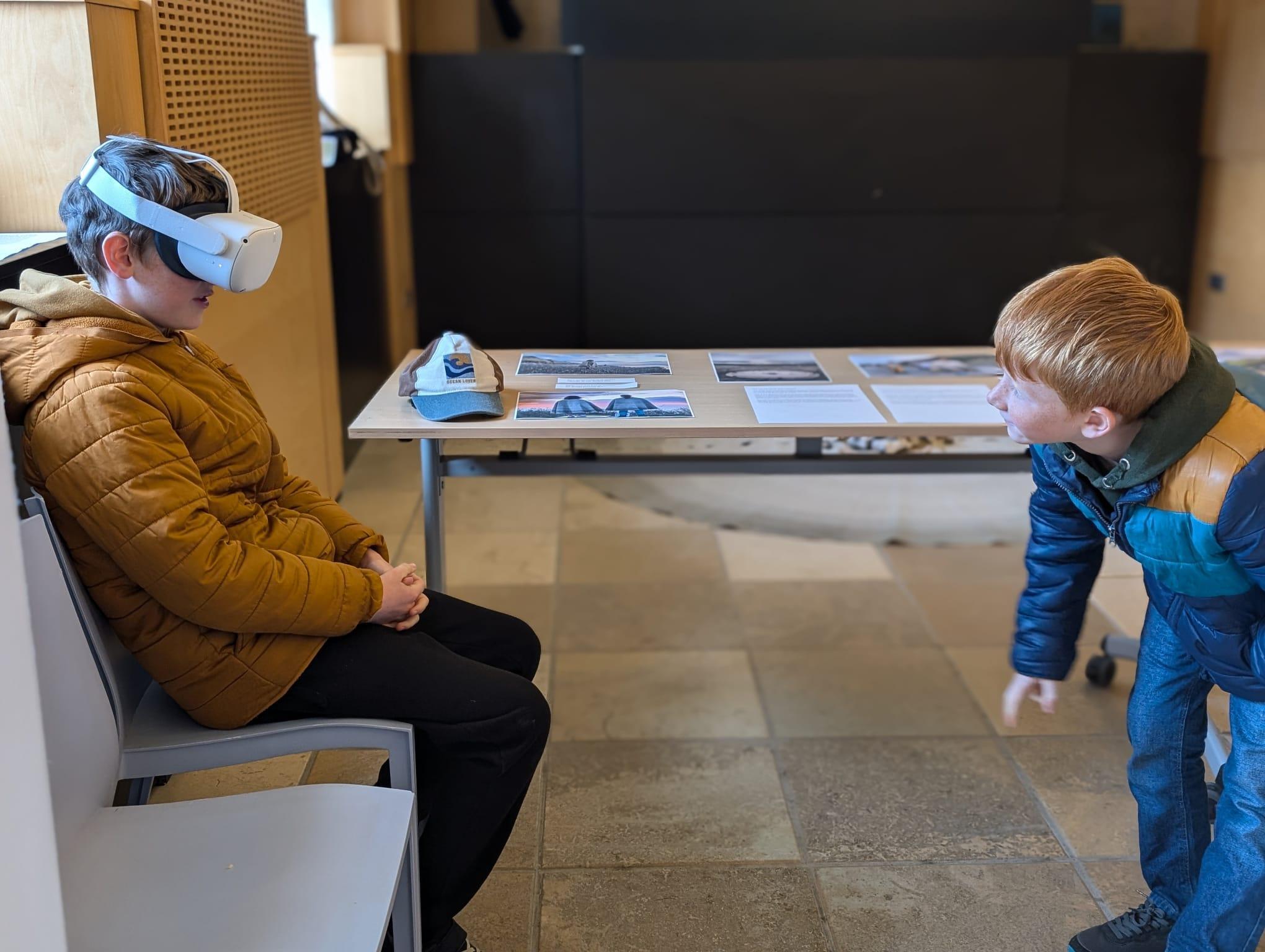 People wearing VR headsets immerse themselves in a virtual experience of a rare chalk stream.