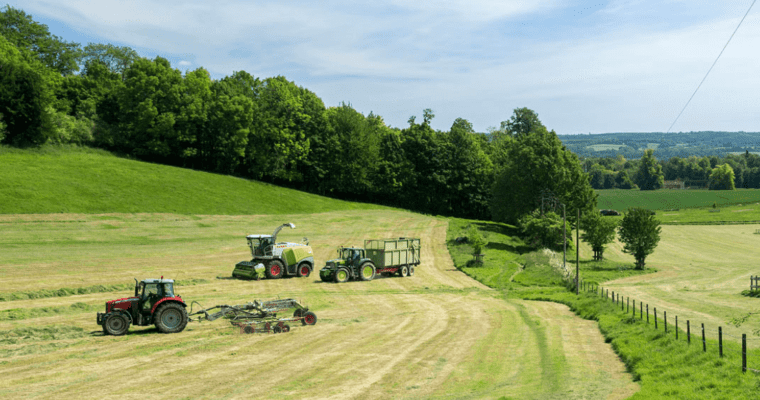 Farm vehicles in green fields in Chevening Estate