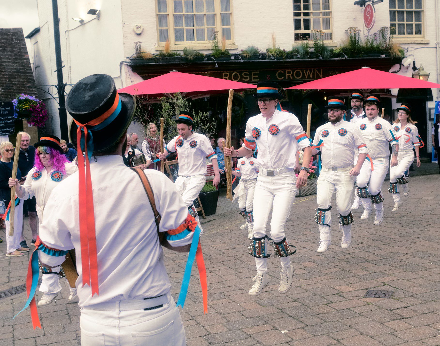 Bower Street Morris perform a dance outside a pub