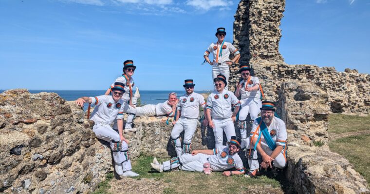 Bower Street Morris pose on a ruin overlooking the sea