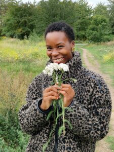 Cherrelle Douglas North Downs Way Ambassador holding a bunch of Yarrow